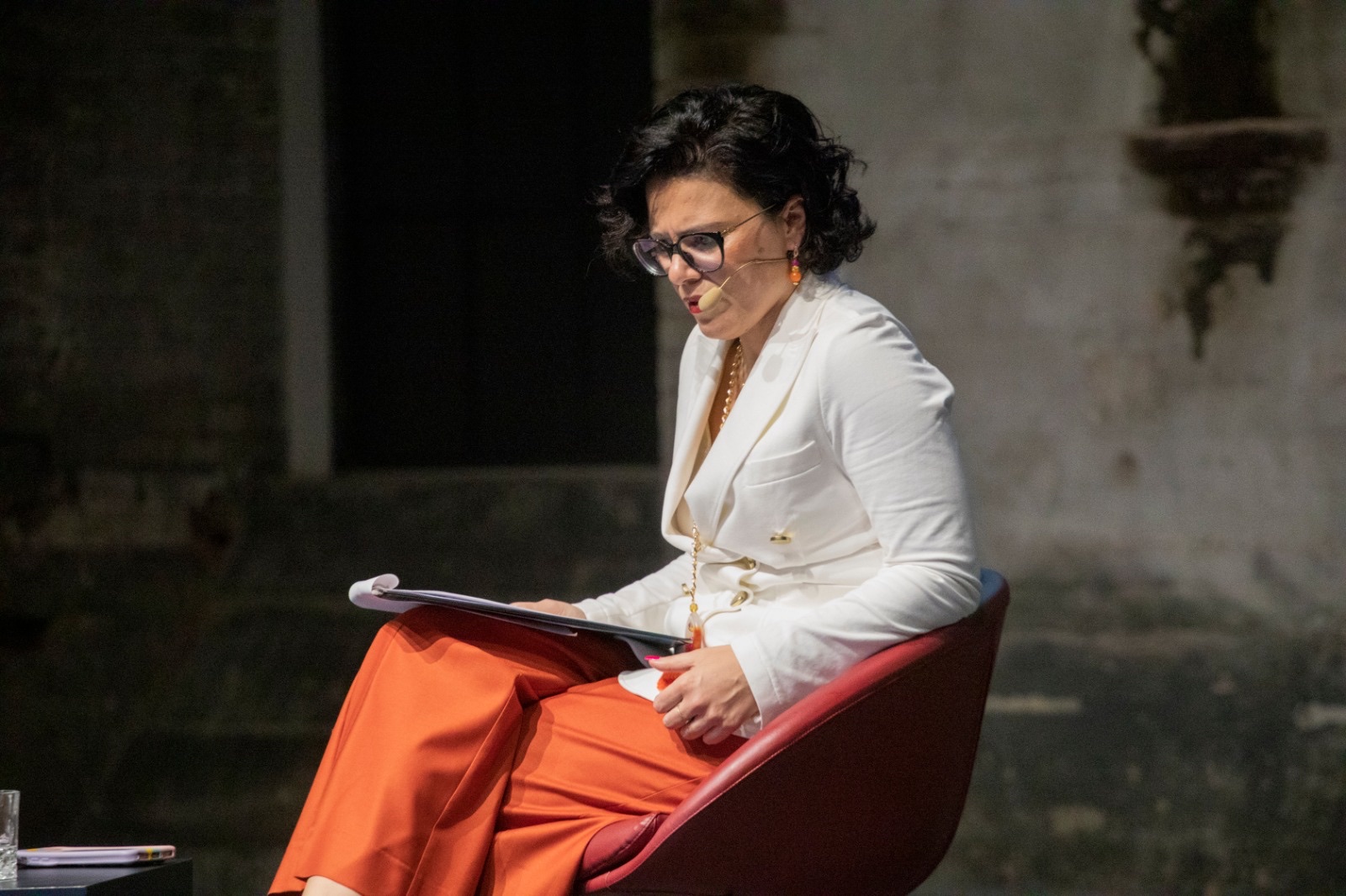 Argia Coppola reading on stage at OGR Torino